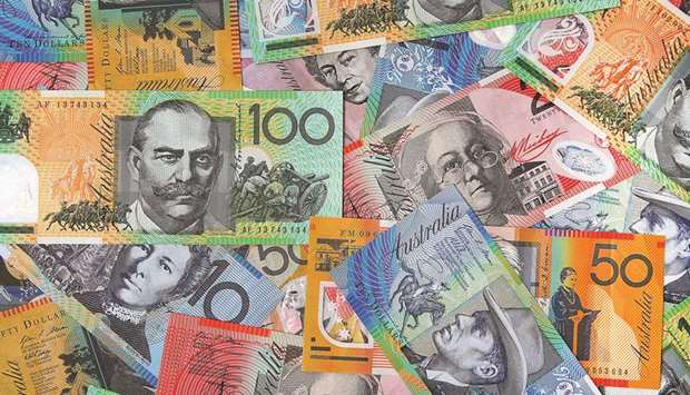 Australian dollar banknotes of various denominations are arranged for a photograph in Sydney.