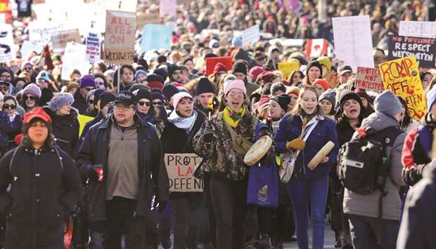 Supporters of the indigenous Wetu2019suwetu2019en Nation march during a protest against British Columbiau2019s pipeline, in Toronto on Monday.