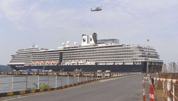 A helicopter takes off next to the Westerdam cruise ship in Sihanoukville yesterday, as authorities checked if any passengers that remained could have the COVID-19 coronavirus.