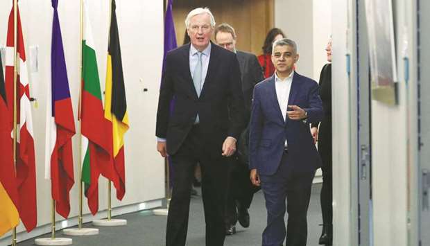 Michel Barnier, European Commissionu2019s head of task force for relations with the United Kingdom, walks with London mayor Sadiq Khan at the EU Commission headquarters in Brussels, Belgium, yesterday.