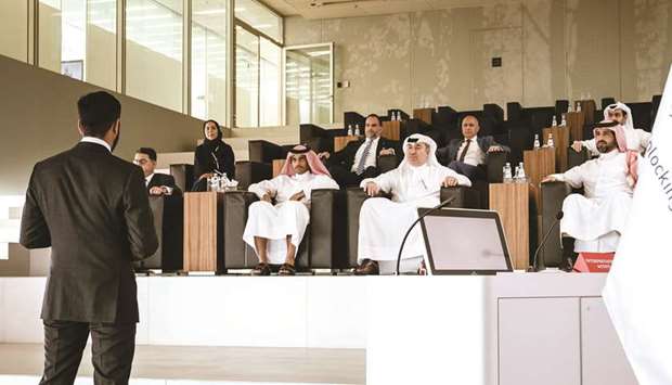 Alfardan Group president and CEO Omar Hussain Alfardan, QF chief financial officer Sheikh Salman bin Hassan al-Thani and other officials attend a presentation at the QF headquarters.