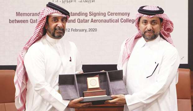QU President Dr Hassan al-Derham and HE the Director General of Qatar Aeronautical College Sheikh Jabor bin Hamad al-Thani at the MoU signing event.