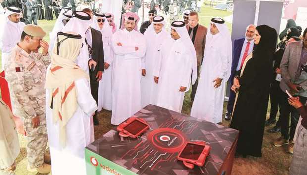 Kahramaa president engineer Essa bin Hilal al-Kuwari and other dignitaries visiting the stall of Vodafone Qatar.