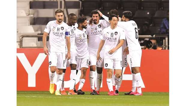 Al Sadd players celebrate a goal during the AFC Champions League match against Sepahan at Jassim Bin Hamad Stadium in Doha on Tuesday. Al Sadd won the match 3-0. 