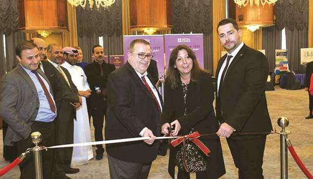 Daniel Phillips and Sam Ayton with other officials at the opening of the university fair. PICTURES: Nasar K Moideen