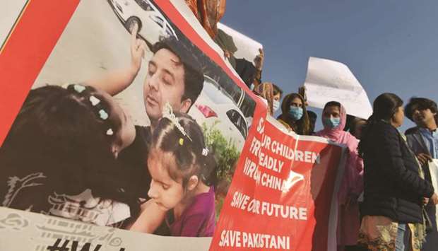 Students and family members of Pakistani students living in the Chinese city of Wuhan, protest in Islamabad to demand their return home.