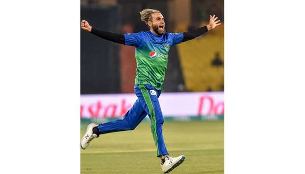 Multan Sultansu2019 Imran Tahir celebrates after the dismissal of Lahore Qalandarsu2019 Dane Vilas at the Gaddafi Cricket Stadium in Lahore yesterday. (AFP)