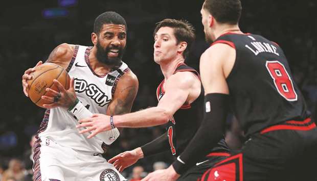 Chicago Bulls guard Ryan Arcidiacono and guard Zach LaVine (right) defend against Brooklyn Nets guard Kyrie Irving (left) during the second-half of their NBA game at Barclays Center. PICTURE: USA TODAY Sports