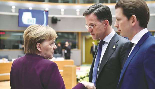 Angela Merkel, Germanyu2019s chancellor (left), speaks with Mark Rutte, Netherlandsu2019s prime minister, (centre) and Sebastian Kurz, Austriau2019s chancellor, ahead of roundtable talks at a EU leadersu2019 summit in Brussels on Thursday. After a night of tough talks, leaders and diplomats worked furiously for a second day to reach an agreement for the EUu2019s seven-year post-Brexit budget, with hopes of a compromise fading as the weekend neared.