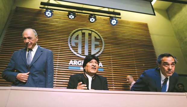 Former Bolivia president Evo Morales arrives at a news conference in Buenos Aires, Argentina, yesterday accompanied by his legal advisers, Argentinau2019s former supreme court judge Eugenio Raul Zaffaroni and Argentinian lawyer Gustavo Ferreyra, after an electoral body banned him from running as a senator candidate in the May election.