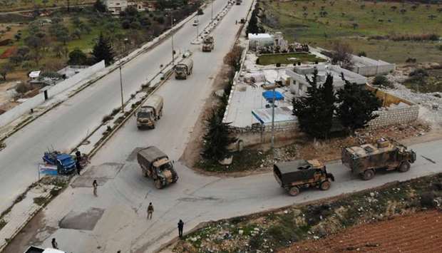An aerial view shows a Turkish military convoy that crossed into the Syrian territory via the Kafr Lusin border, passing near Syria's northwestern city of Idlib and heading toward the south of the Idlib province.