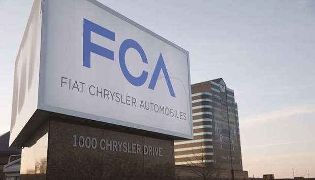 The new FCA (Fiat Chrysler Automobile) logo is displayed in front of Chrysler Group LLC World Headquarters in Auburn Hills, Michigan, US, on Tuesday, May 6, 2014. Fiat SpA Chief Executive Officer Sergio Marchionne will cover the billions planned for new Alfa Romeos, Maseratis and Jeeps out of existing funds, without selling or spinning off any of the automakeru2019s brands, four people familiar with the matter said. Photographer: Jeff Kowalsky/Bloomberg