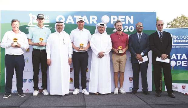 Qatar Golf Association General Secretary Fahad Nasser al-Naimi (fourth from right) poses with the Qatar Open Championship winners and other officials at the Doha Golf Club yesterday. PICTURES: Jayaram