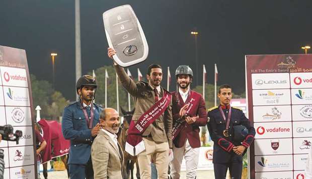 Amiru2019s Sword winner Salman Mohamed al-Emadi (third from left) celebrates with Medium Tour top three finishers during the His Highness The Amiru2019s Sword Showjumping Championship at the Qatar Equestrian Federationu2019s outdoor arena yesterday.
