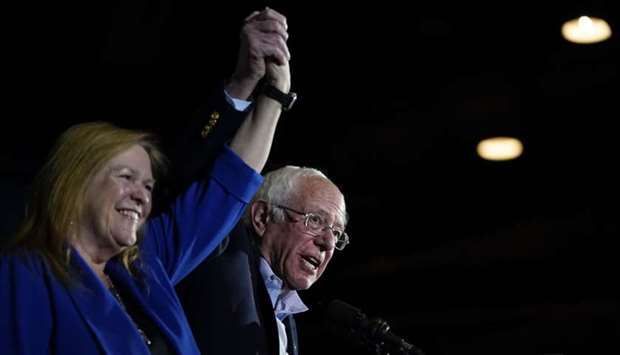 Democratic presidential candidate Sen. Bernie Sanders and his wife Jane Sanders take the stage after Sanders won the Nevada caucuses during a campaign rally at Cowboys Dancehall in San Antonio, Texas