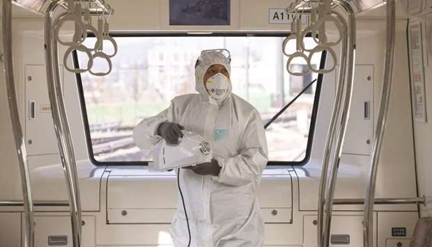 A worker wearing a protective suit sprays disinfectant onto a subway train in Gimpo, South Korea. Delegates at the G20 meeting in Riyadh spent much of their time talking about a global slowdown exacerbated by the coronavirus outbreak, but struggled to come up with a united response, according to people familiar with the deliberations.