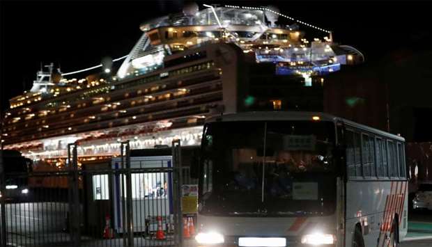 Passengers leave cruise ship Diamond Princess at Daikoku Pier Cruise Terminal in Yokohama