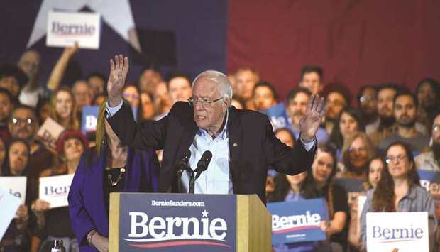 Democratic presidential candidate Senator Bernie Sanders celebrates after being declared the winner of the Nevada Caucus at a campaign rally in San Antonio, Texas, on Saturday night.