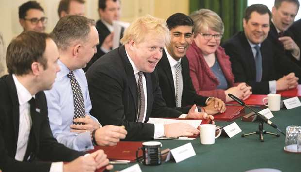 Prime Minister Boris Johnson speaks during his first cabinet meeting next to a new appointed Chancellor of the Exchequer Rishi Sunak, following a reshuffle the day before, at Downing Street in London.