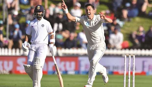 New Zealandu2019s Trent Boult (right) celebrates Indiau2019s captain Virat Kohliu2019s (not in the picture) wicket during day three of the first Test at the Basin Reserve in Wellington yesterday. (AFP)