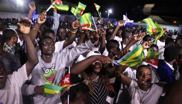 Supporters of President Faure Gnassingbe ,Presidential candidate of UNIR (Union for the Republic) and winner of the presidential election celabrate at their headquarters in Lome, Togo