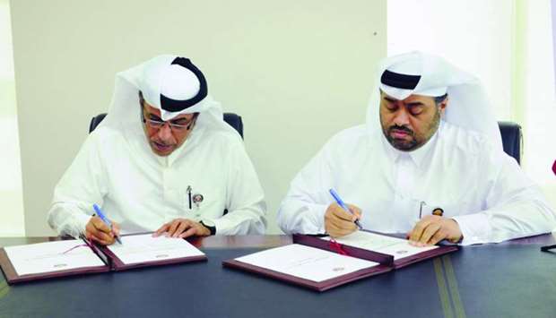 Officials of the Ministry of Culture and Sports and the Ministry of Municipality and Environment signing the agreement