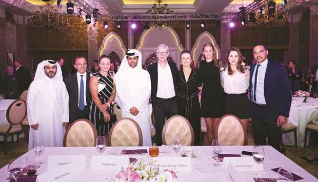 QTSBF President Nasser al-Khelaifi (fourth from left), Secretary-General Tariq Zainal (left), former Arsenal manager Arsene Wenger (centre) and former Moroccan tennis player Karim Alami (right) pose with tennis players Ashleigh Barty (third from left), Elina Svitolina (fourth from right), Karolina Pliskova (third from right) and Belinda Bencic (second from right) during the gala dinner on Sunday.