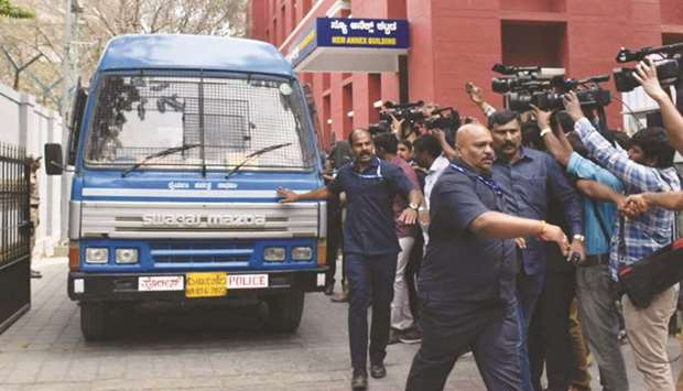 Underworld don Ravi Pujari is brought in a police van to be produced at the first Additional City Metropolitan Magistrate (ACMM) court in Bengaluru yesterday.