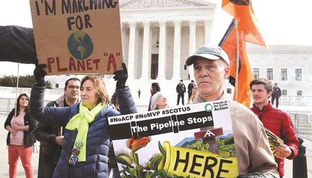 Climate activists protest in front of the US Supreme Court as oral arguments are being heard in the US Forest Service and Atlantic Coast Pipeline, LLC vs Cowpasture River Association case yesterday in Washington, DC.