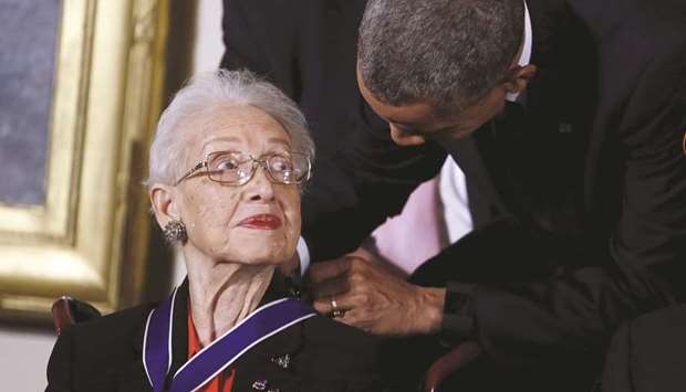 A November 24, 2015, file photo of  then-president Barack Obama presenting the Presidential Medal of Freedom to Nasa mathematician Katherine G Johnson during an event in the East Room of the White House in Washington.