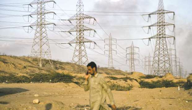 Power transmission lines hang from electricity pylons at the Bin Qasim Power Station II plant in Karachi.