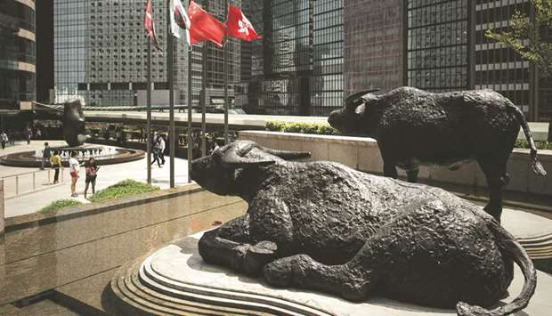 Bull statues displayed outside the Hong Kong Stock Exchange building.