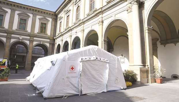 This picture taken yesterday shows a pre-triage medical tent in front of Santa Maria Nuova Hospital in Florence, as Tuscany reported its first two cases of Covid-19.