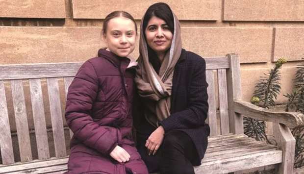 This picture taken from social media shows Thunberg with Yousafzai at Lady Margaret Hall.
