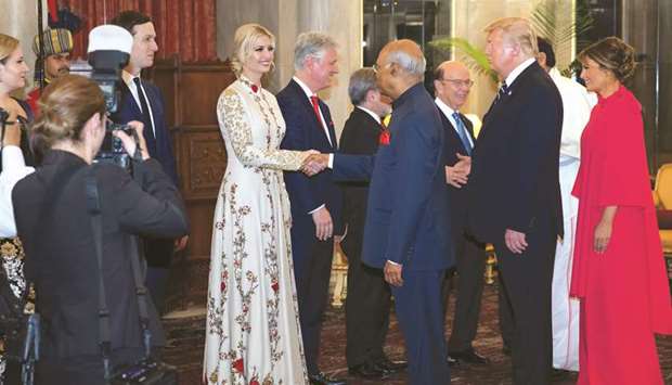 White House Senior Adviser Jared Kushner and his wife Ivanka Trump are greeted by President Ram Nath Kovind during a state banquet as President Donald Trump and First Lady Melania Trump look on at Rashtrapati Bhavan in New Delhi yesterday.