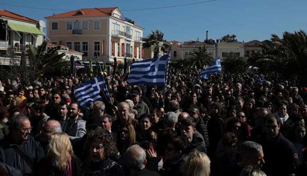 Locals, who oppose the building of a new closed migrant detention centre, take part in a demonstration in the city of Mytilene, on the island of Lesbos, Greece