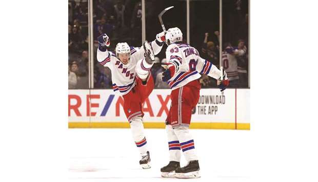 Mika Zibanejad (right) of the New York Rangers celebrates after scoring a game winning overtime goal against the New York Islanders with teammate Artemi Panarin in New York. (Getty Images/AFP)
