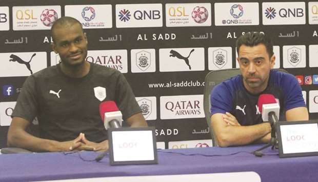 Al Sadd head coach Xavi Hernandez (right) and defender Abdelkarim Hassan at a press conference yesterday.