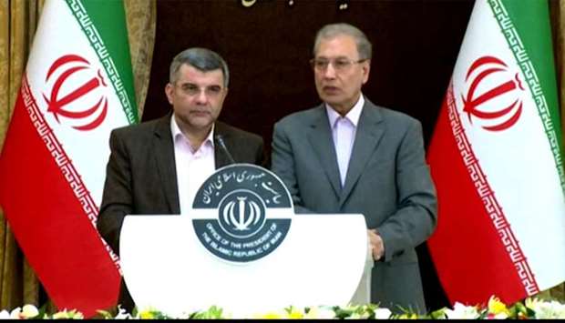 Iran's government spokesman Ali Rabiei (R) and deputy health minister Iraj Harirchi speaking during a press conference in Tehran.