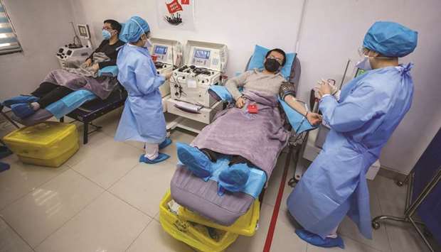 Doctors who have recovered from the Covid-19 coronavirus infection donating plasma in Wuhan in Chinau2019s central Hubei province. Chinese health officials urged patients who have recovered from the coronavirus to donate blood so that plasma can be extracted to treat others who are critically ill.