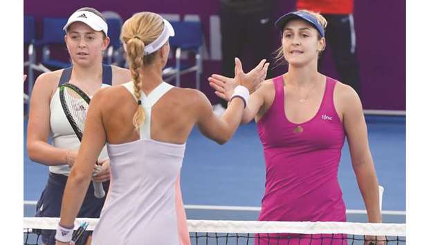 Latviau2019s Jelena Ostapenko (left) and Canadau2019s Gabriela Dabrowski (right) are congratulated by their opponents Timea Babos and Kristina Mladenovic (not pictured) after the win in the Qatar Total Open doubles semi-final yesterday. PICTURE: Noushad Thekkayil