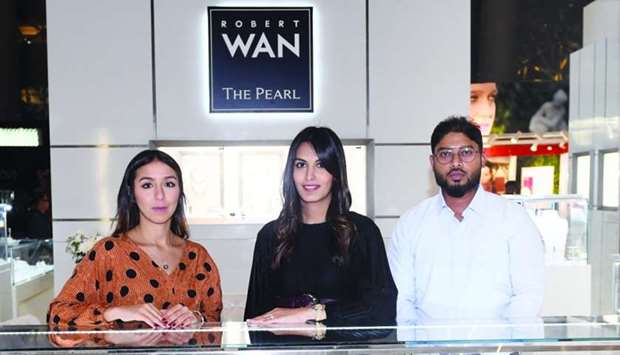 Wafa Habbar (left) and his colleagues at the Robert Wan booth. PICTURES: Shemeer Rasheed