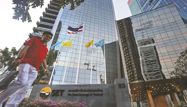 A pedestrian walks past the Stock Exchange of Thailand building in Bangkok. The tumble this week has pushed equity benchmarks of Thailand, Indonesia and the Philippines to rank among the worldu2019s 10 worst-performing major markets this year.