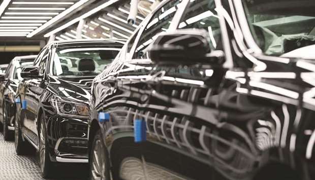 Hyundai Motor Genesis luxury sedans move along a conveyor belt on the production line at the companyu2019s plant in Ulsan. The firm operates five car factories in Ulsan, which has an annual production capacity of 1.4mn vehicles, or nearly 30% of Hyundaiu2019s global production.