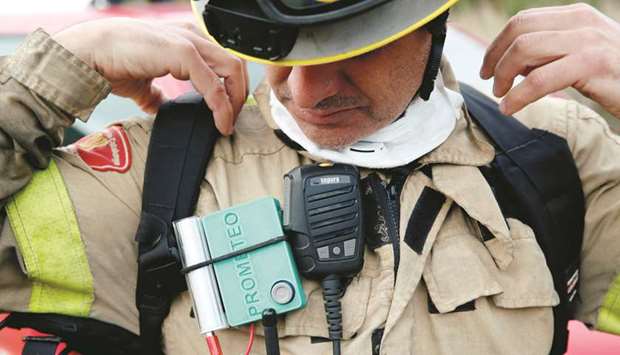 A Prometeo monitoring device (by IBM) is worn by a firefighter during prescribed burn of the forest in Olivella, south of Barcelona, Spain.