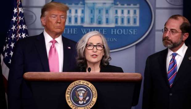 US President Donald Trump and Health and Human Services (HHS) Secretary Alex Azar listen as Dr. Anne Schuchat, Principal Deputy Director of the Centers for Disease Control and Prevention (CDC) gives a news conference at the White House in Washington on Wednesday