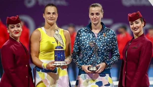 Aryna Sabalenka (C-L) of Belarus and Petra Kvitova (C-R) of Czech Republic pose with their trophies following final of the Qatar Total Open tournament in Doha,