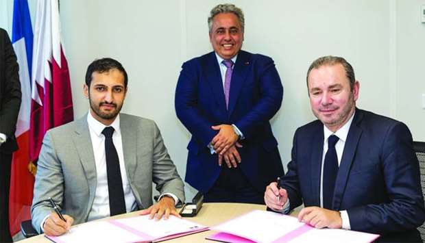 Sheikh Ali Alwaleed Al-Thani, Sheikh Ali bin Jassem al-Thani (centre) and Christophe Lecourtier following the Letter of Intent signing.