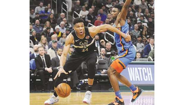 Milwaukee Bucks forward Giannis Antetokounmpo (left) drives to the basket past Oklahoma City Thunder's Nerlens Noel during the NBA match in Milwaukee on Friday. (USA TODAY Sports)