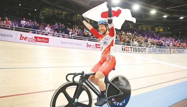 Japanu2019s Yumi Kajihara celebrates after winning the womenu2019s omnium elimination race and points race at the UCI track cycling World Championship in Berlin. (AFP)